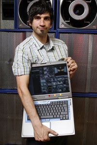 Guy Holding Laptop Full Of Resolume!