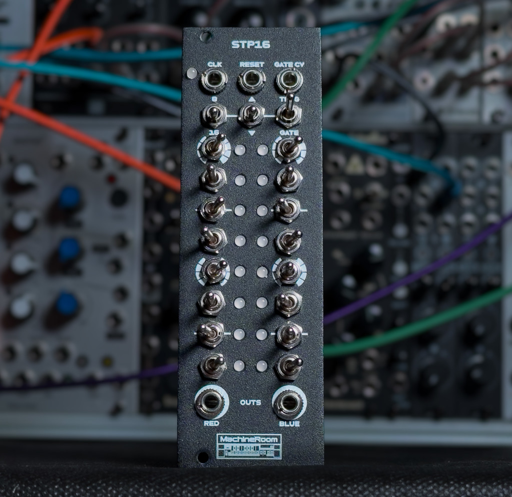 Eurorack module from MachineRoom with two vertical columns of switches and two columns of LEDs in between (with a blurred modular in the background)