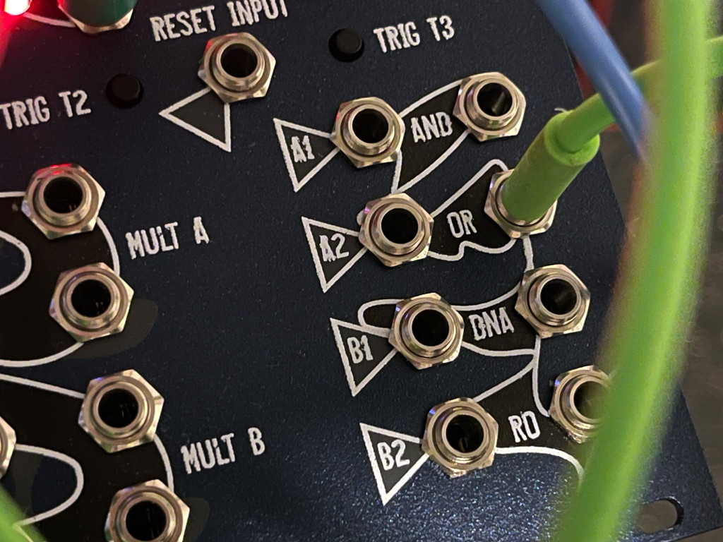 Logic gates - A1/A2 inputs with AND and OR outputs, and B1/B2 inputs with NAND and NOR outs (labeled DNA and RO) next to mults.