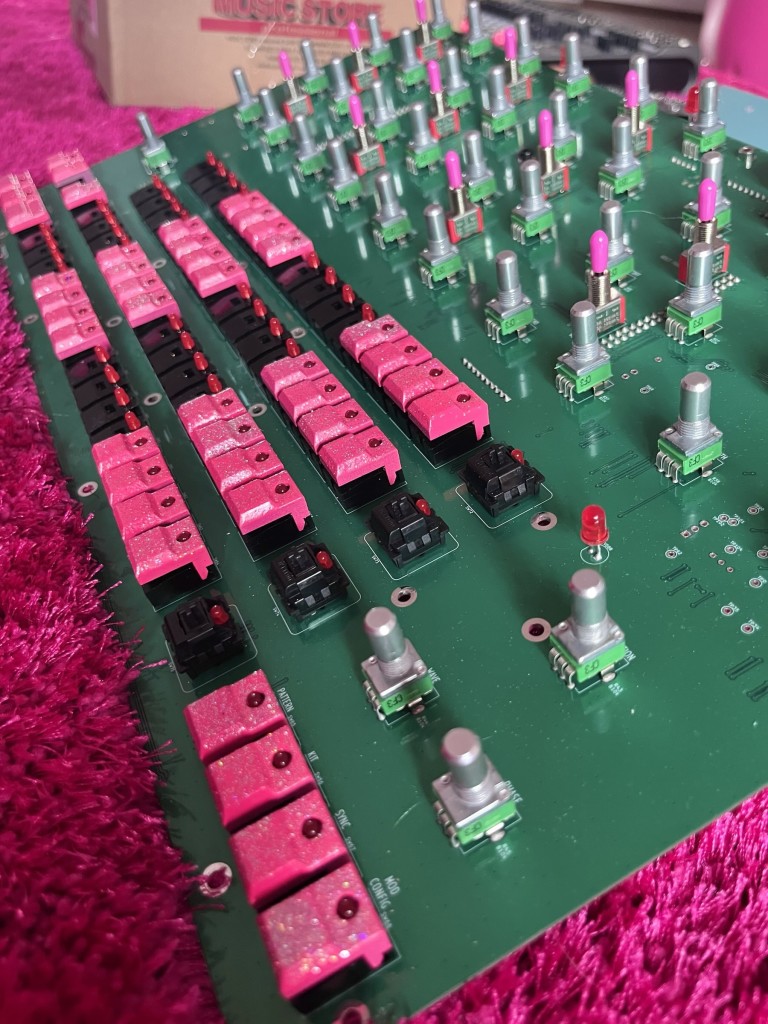 Inside the Erica Synths PERKONS mod - singling out switches and buttons with pink custom paint job / pink with silver specks