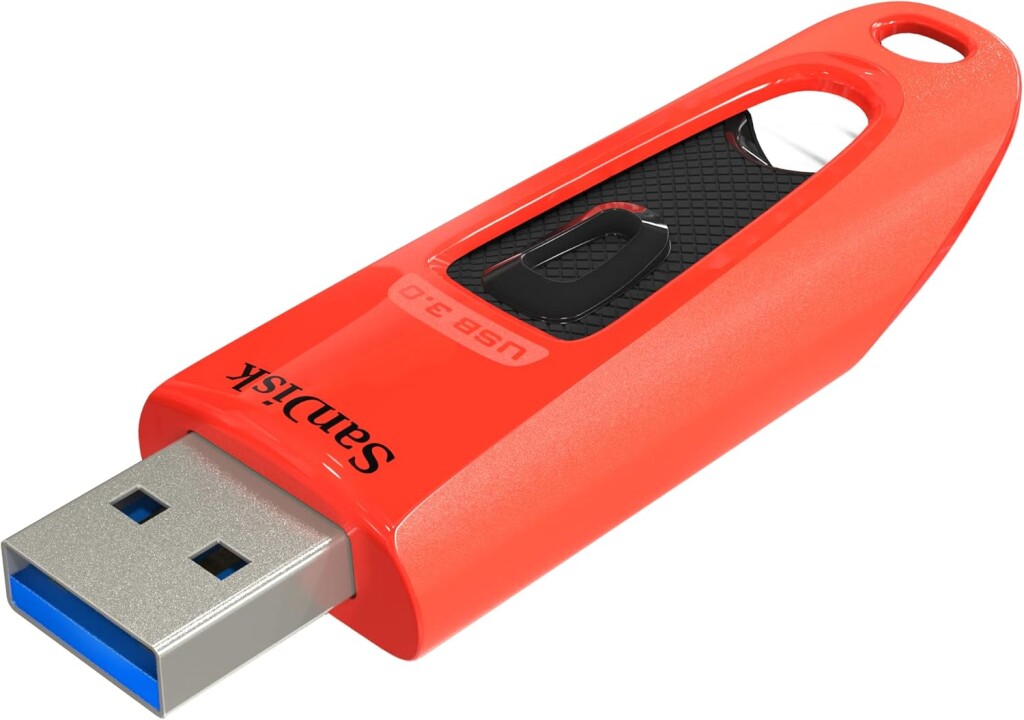 A big 'ol orange USB thumb drive from Sandisk with key holder hole in the back and USB-A port in the front, plus retract button