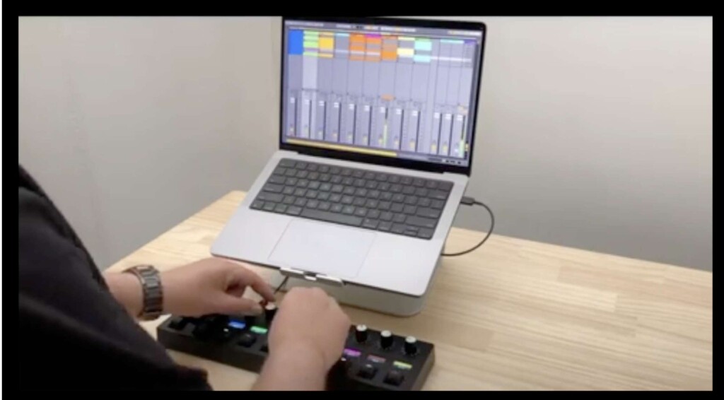 Frame from leaked video showing controller box next to MacBook