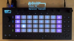 Ableton Move hardware, compact grid-based standalone groovebox, running Move Everything, showing overlay of (streamed) display wit OB-Xd open source Oberheim model and cutoff parameter