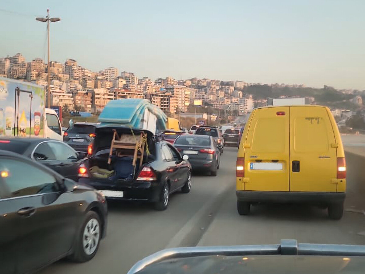 Displaced families stuck in traffic, March 2026 -- photo Ahmad Badr/NRC