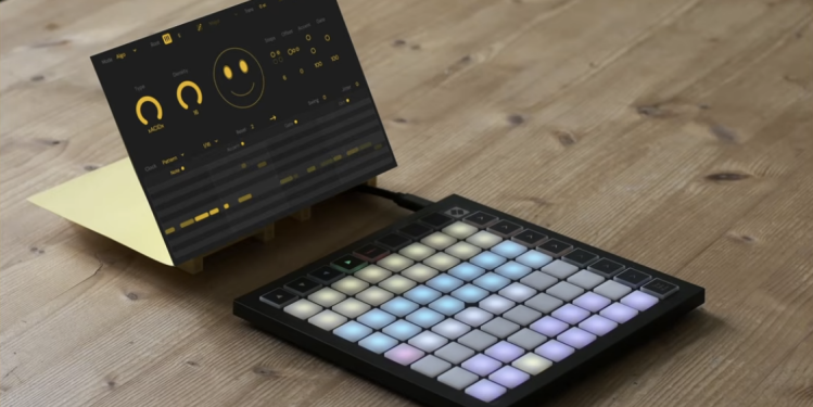 Virtual rendering of the Sting UI with knobs, piano roll view, and smiley face, angled next to a Novation Launchpad controller with light-up grid.