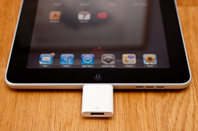 Apple's iPad Camera Connection Kit, providing a USB port, as connected to a first-gen iPad. (CC-BY) Håkan Dahlström Photography